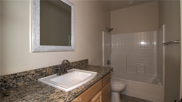 full bathroom with shower / washtub combination, vanity, and toilet