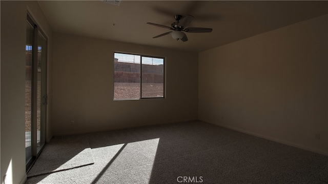 spare room with carpet flooring and ceiling fan