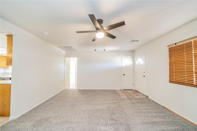 empty room with light carpet and ceiling fan