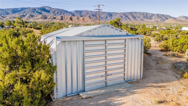 view of outbuilding with a mountain view