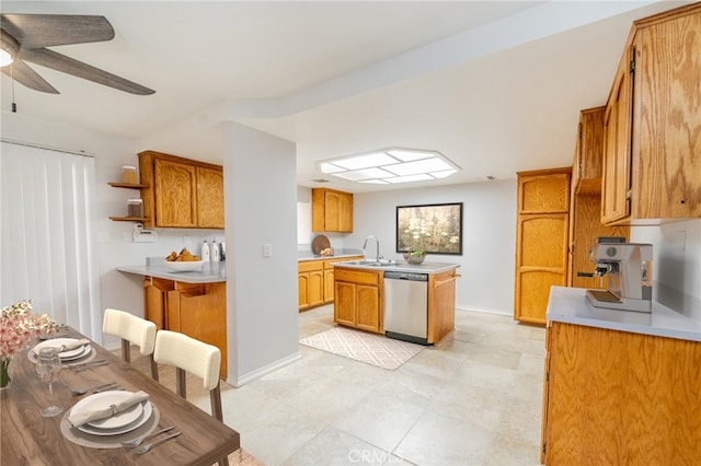 kitchen with dishwasher, ceiling fan, kitchen peninsula, and sink