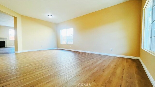 unfurnished room with light hardwood / wood-style floors