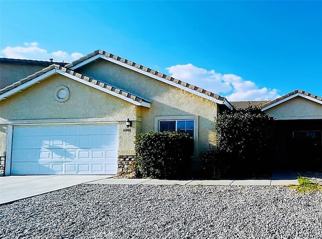 single story home featuring a garage