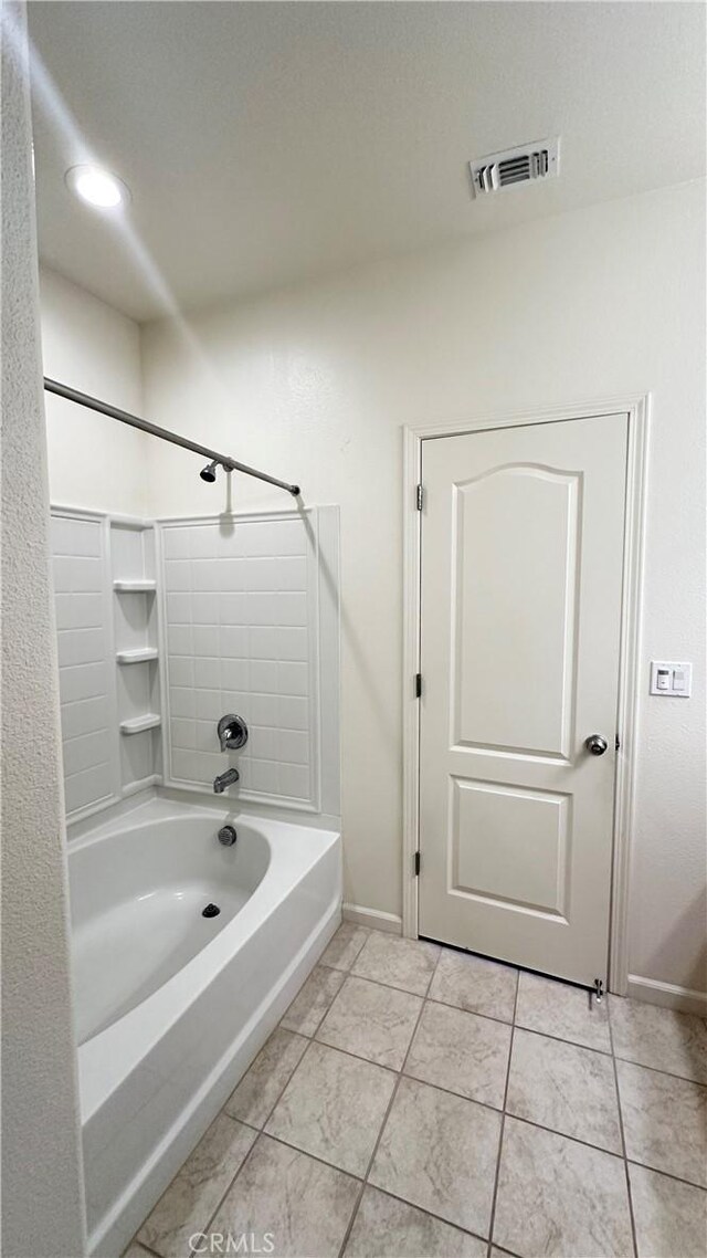 bathroom featuring tile patterned floors and shower / washtub combination