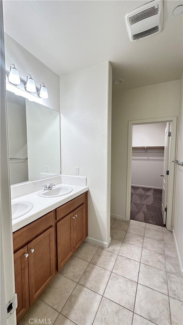 bathroom with vanity and tile patterned floors