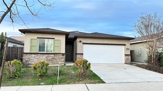 prairie-style home with concrete driveway, an attached garage, stone siding, and stucco siding