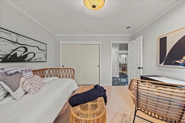 bedroom with ornamental molding and a closet