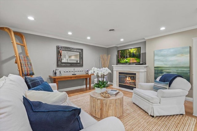 living room featuring crown molding and light wood-type flooring