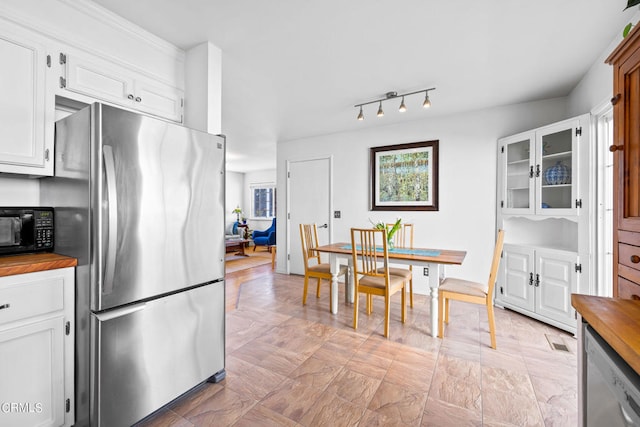 kitchen with stainless steel appliances and white cabinets