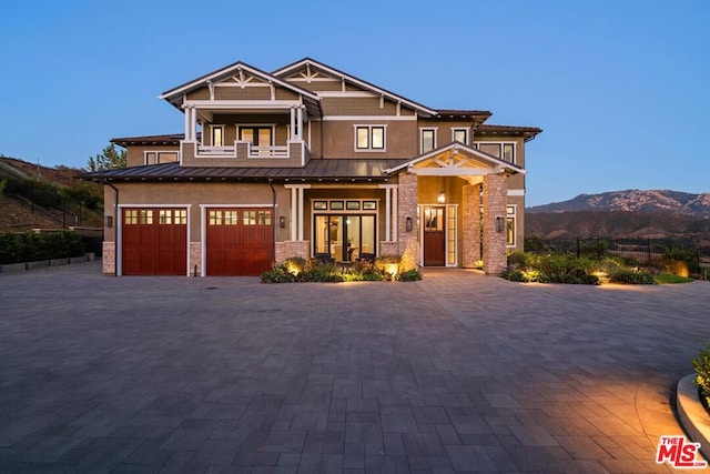 view of front of home featuring a mountain view and a garage