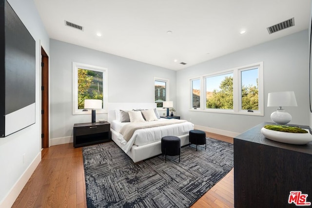 bedroom featuring dark hardwood / wood-style flooring