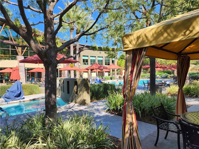 view of pool with a patio and a gazebo