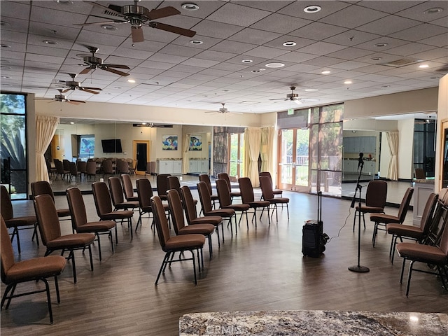 misc room featuring hardwood / wood-style flooring and a paneled ceiling