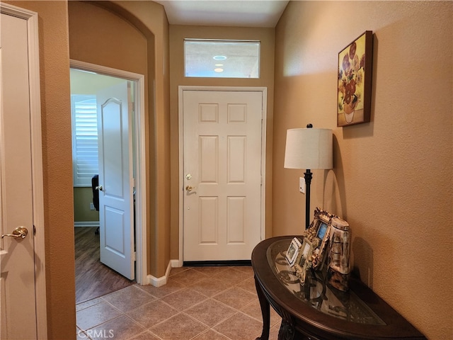 entryway with hardwood / wood-style flooring