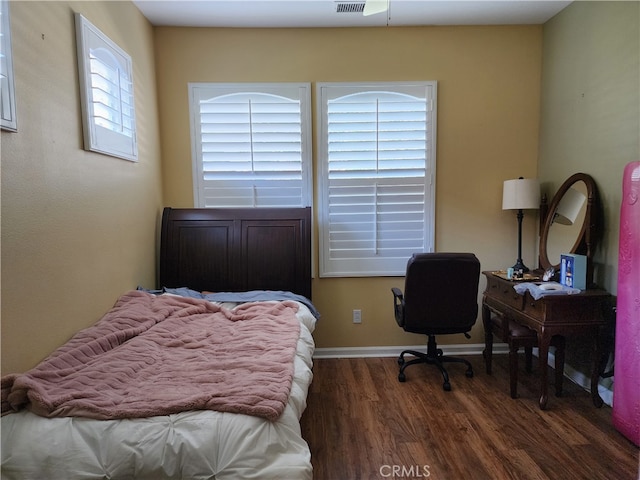 bedroom featuring dark hardwood / wood-style floors