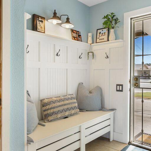 mudroom with light tile patterned flooring