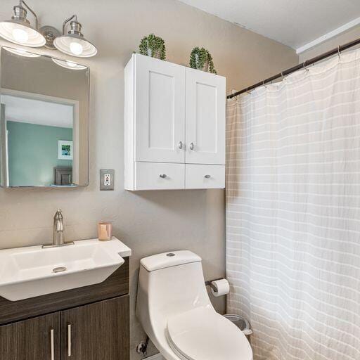 bathroom with vanity and toilet