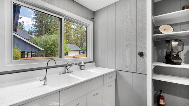 bathroom with vanity and crown molding