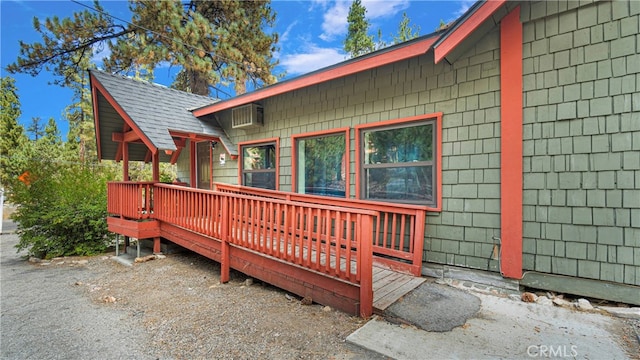 view of home's exterior featuring a wooden deck