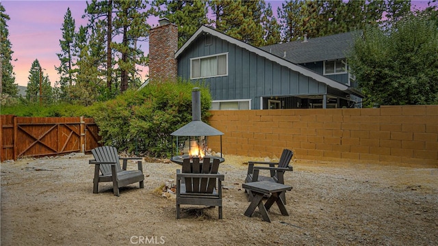 patio terrace at dusk with an outdoor fire pit