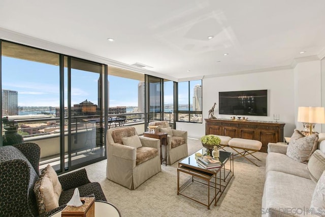 living room featuring ornamental molding, expansive windows, and light carpet