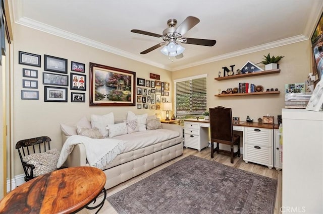 office featuring crown molding, ceiling fan, and light hardwood / wood-style flooring