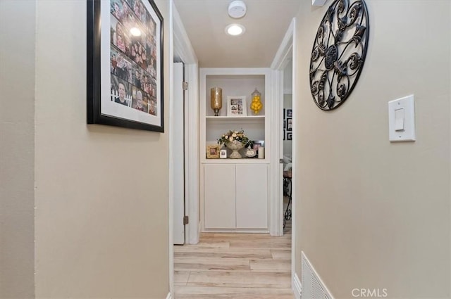 hallway featuring light hardwood / wood-style flooring