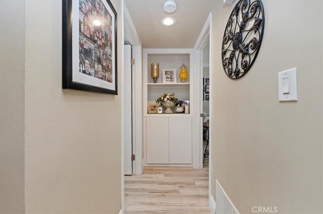 hallway featuring light hardwood / wood-style flooring