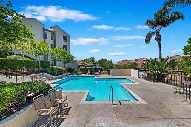 view of pool featuring a patio