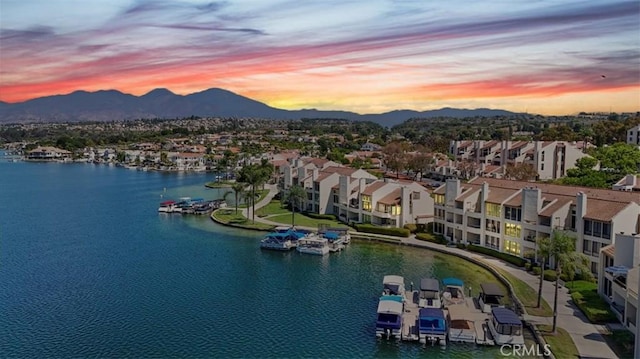 aerial view at dusk with a water and mountain view