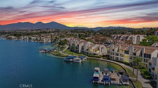 aerial view at dusk with a water and mountain view