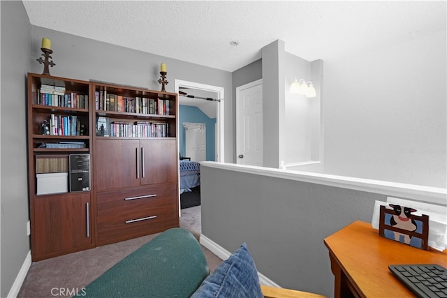 carpeted bedroom featuring a textured ceiling