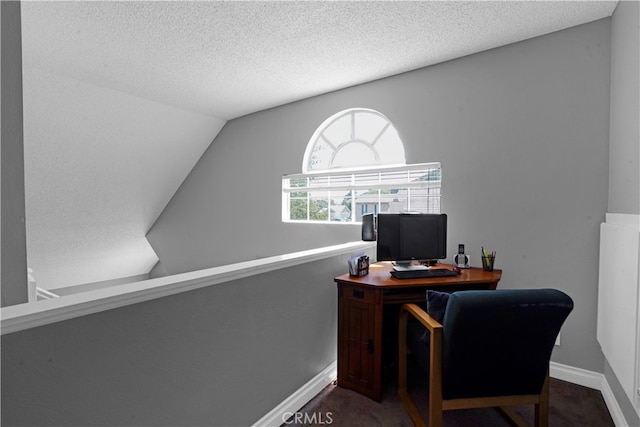 office featuring a textured ceiling and vaulted ceiling