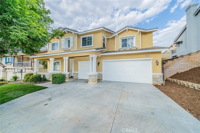 craftsman inspired home with stone siding, driveway, an attached garage, and stucco siding