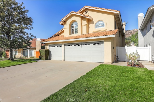 view of front facade with a front yard and a garage