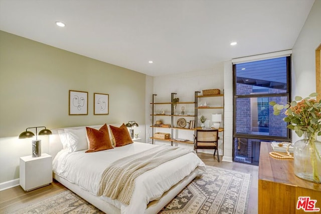 bedroom featuring light wood-type flooring