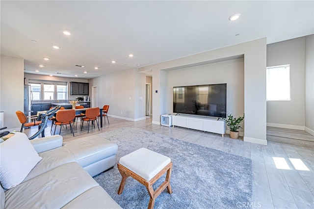 living room with light hardwood / wood-style floors