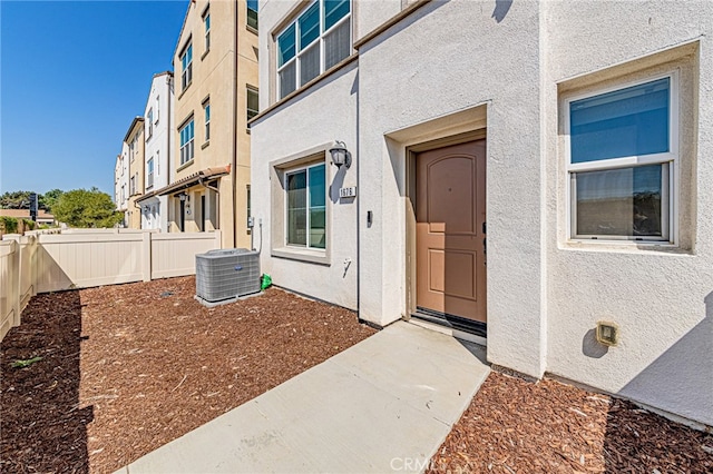 doorway to property with cooling unit