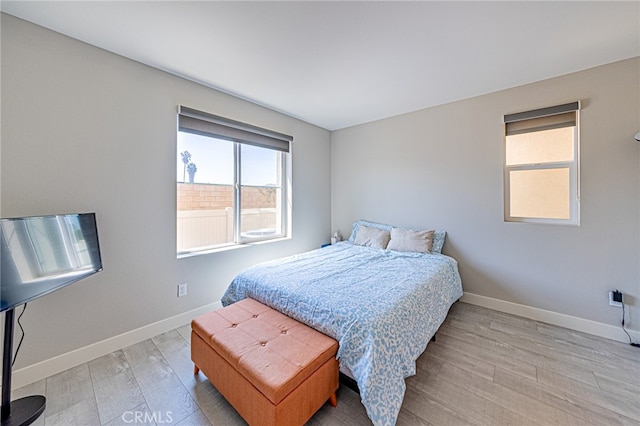 bedroom with light wood-type flooring