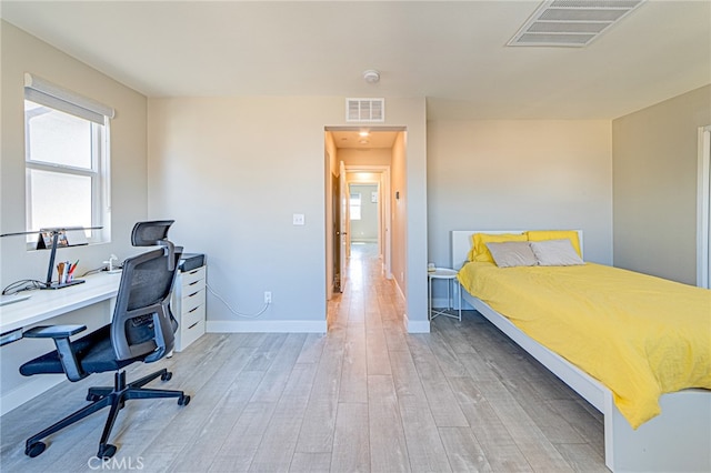 bedroom featuring light hardwood / wood-style floors