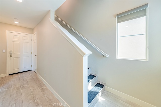 stairway featuring wood-type flooring