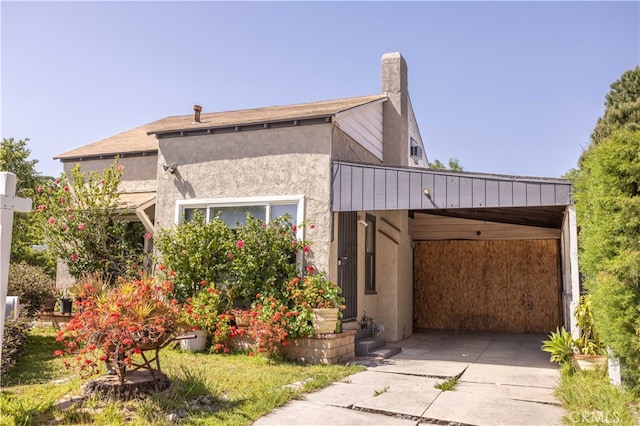 view of front of home featuring a carport