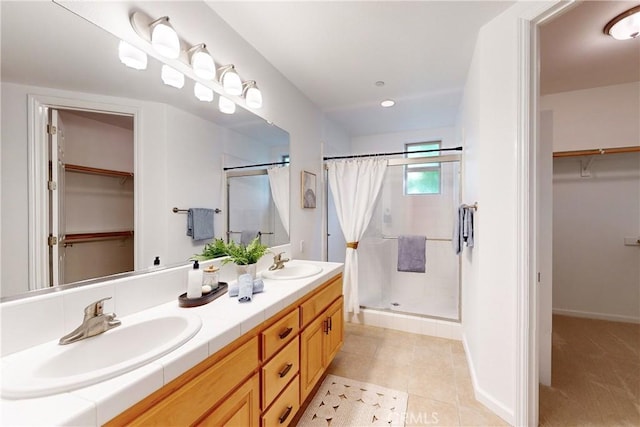 bathroom featuring tile patterned floors, a shower with curtain, and vanity