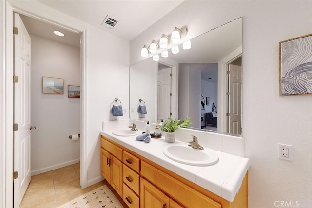 bathroom featuring tile patterned floors and vanity