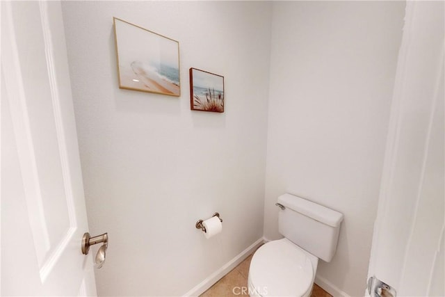 bathroom with tile patterned flooring and toilet