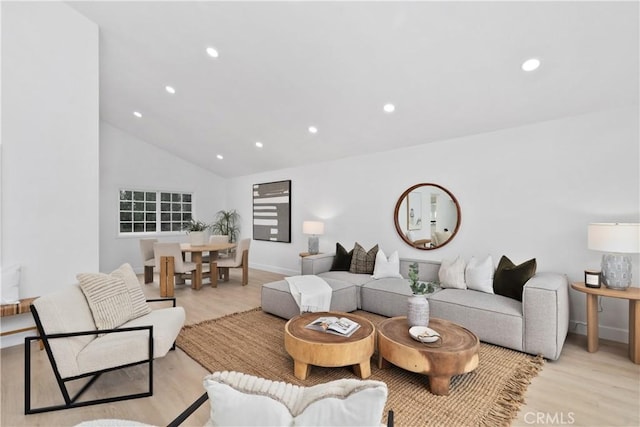 15562 Placid Cir, Huntington Beach, CA 92647 - living area with vaulted ceiling, light wood-style flooring, recessed lighting, and baseboards