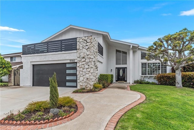 15562 Placid Cir, Huntington Beach, CA 92647 - view of front of house with a front lawn, an attached garage, board and batten siding, and driveway