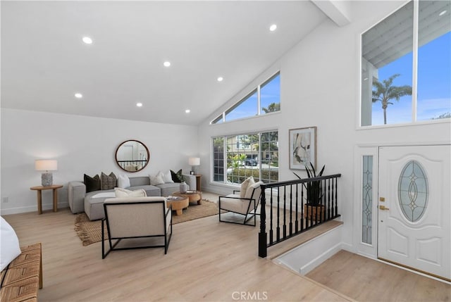 15562 Placid Cir, Huntington Beach, CA 92647 - living area with baseboards, recessed lighting, light wood-type flooring, and high vaulted ceiling