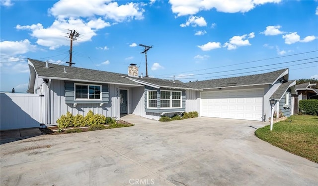 ranch-style house featuring a garage