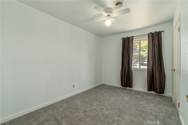 empty room featuring ceiling fan and light colored carpet